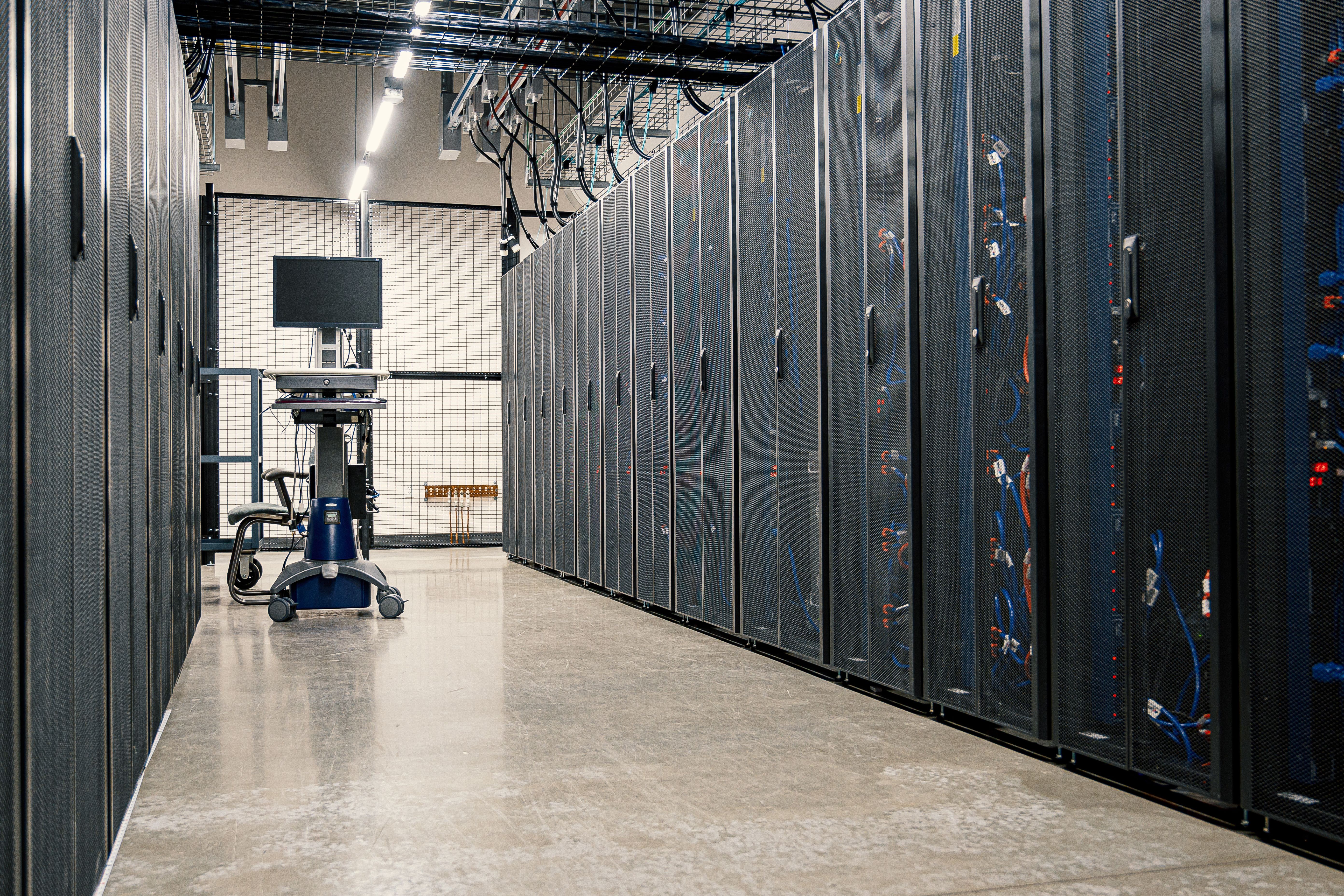 Steel server racks and cabling in a modern data centre